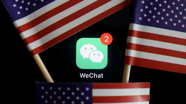The messenger app WeChat is seen among U.S. flags in this illustration picture taken Aug. 7, 2020. (Reuters)