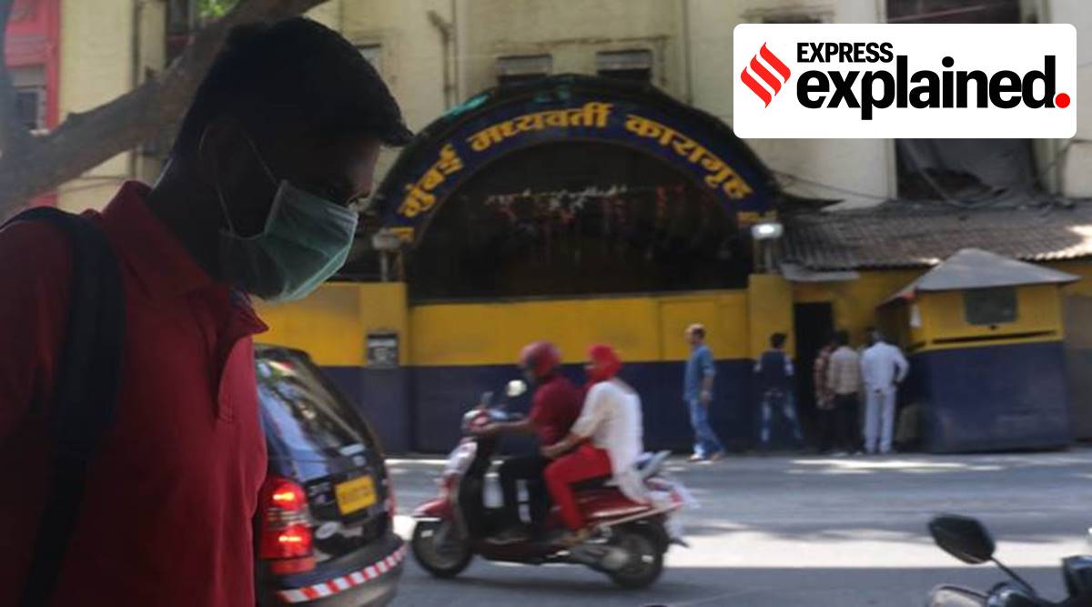 Relatives of the prisoner wearing a mask in front of Arthur Road jail. (File/Express Photo by Ganesh Shirsekar)