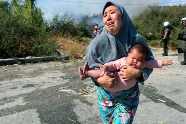 Greece camp fire, Greece refugee camp fire, asylum seekers camp fire, lesbos camp fire, indian express