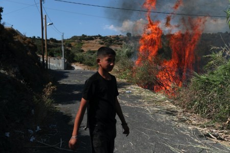 Greece camp fire, Greece refugee camp fire, asylum seekers camp fire, lesbos camp fire, indian express