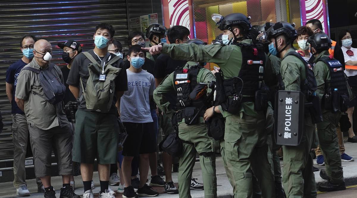 Hong Kong, Hong Kong Police, Hong Kong Police tackle girl, Hong Kong protests, Hong Kong anti-sedition law protests, anti-sedition law protests Hong Kong, world news, Indian Express