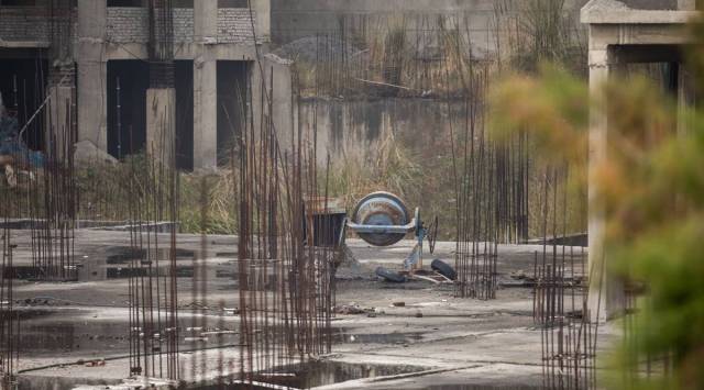 A cement mixer stands at an abandoned construction site in Noida, Uttar Pradesh, India, on Monday, Jan. 20, 2020. (Photographer: Prashanth Vishwanathan/Bloomberg))