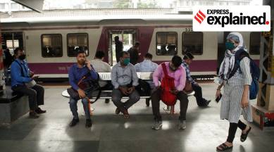 Commuters wait on a railway platform after trains were stalled during a power outage in Mumbai (Reuters)