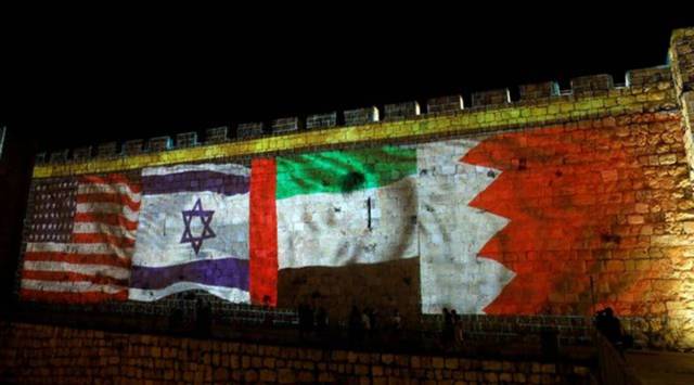National flags of Bahrain, UAE, Israel and the U.S. are projected on the walls of Jerusalem's Old city September 15, 2020. REUTERS/ Ronen Zvulun/File Photo