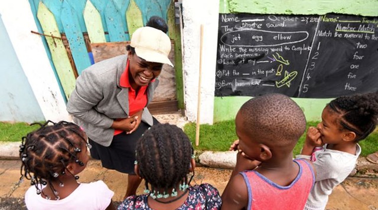 Jamaican teacher turns walls into blackboards to teach