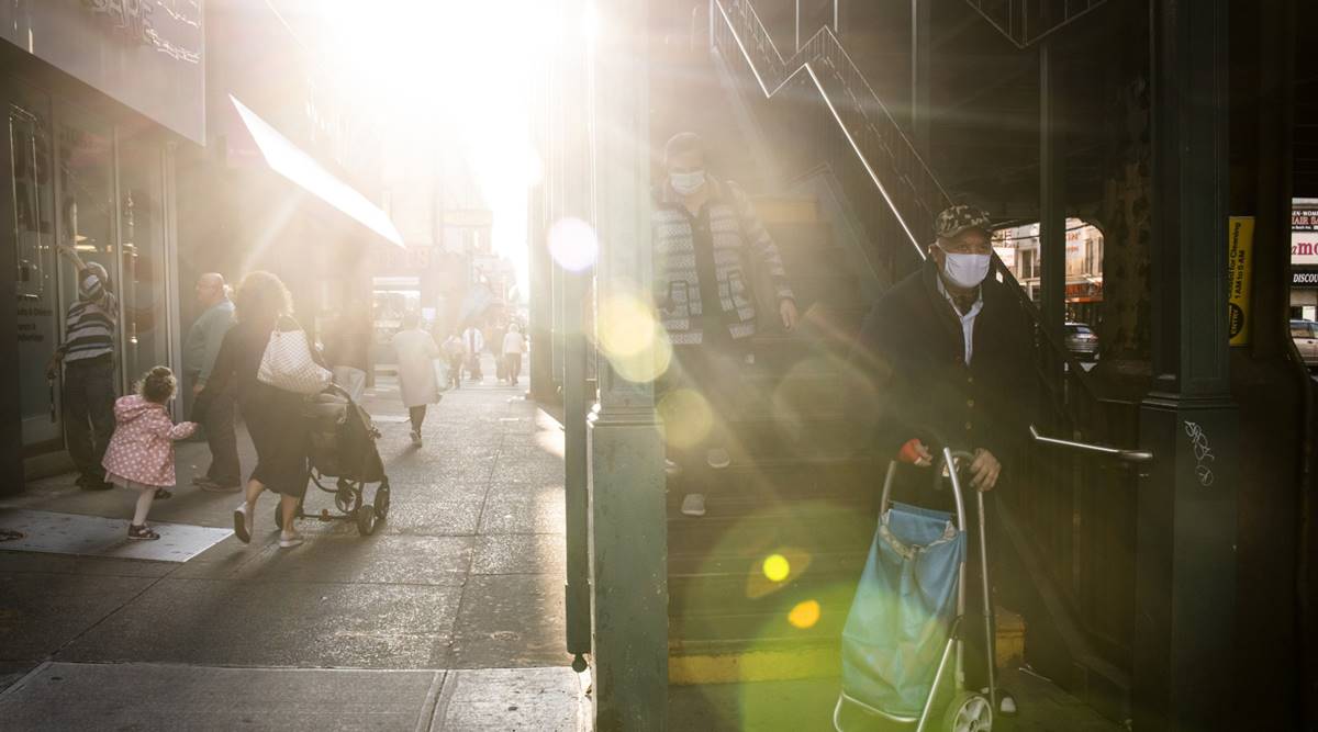 People wearing protective masks exit the Brighton Beach subway station in the Brighton Beach neighborhood in the Brooklyn borough of New York, U.S., on Monday, Oct. 5, 2020. Governor Andrew Cuomo said New York City public and private schools in viral hot spots must close Tuesday, and he threatened to shut religious institutions if members dont follow rules about masks and social distancing. IMF's report call for reconsidering the idea that lockdowns involve a trade-off between savings lives and supporting the economy. (Bloomberg)