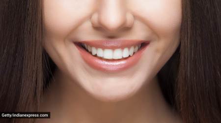 white teeth, how to get whitened teeth, white teeth, ayurvedic ways for white teeth, what is oil pulling, how to do oil pulling, indianexpress.com, indianexpress, tongue scrapping, how to do tongue cleaning, ayurveda remedies for white teeth, dixa bhavsar,
