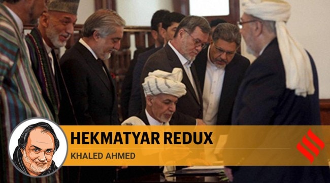 In this Sept. 29, 2016, photo, Afghan President Ashraf Ghani, center, signs a peace agreement with Gulbuddin Hekmatyar, a notorious warlord on terrorist blacklists, at the presidential palace in Kabul, Afghanistan. (Source: AP/PTI photo)
