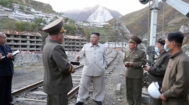 North Korean leader Kim Jong Un visits the typhoon-ravaged rural town of Komdok, North Korea, to inspect recovery works. (AP/PTI Photo)