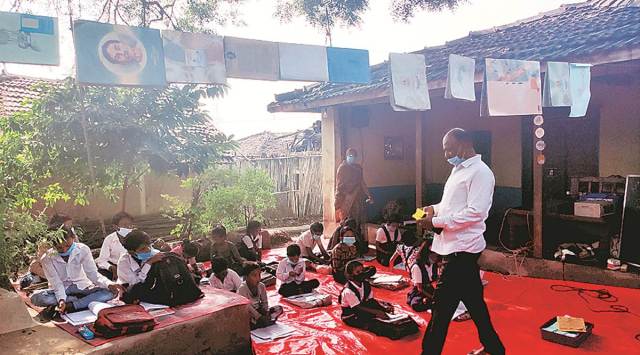 ‘Mohalla’ class under a neem tree in Sehore’s Ambdo village. (Express photo by Iram Siddique)