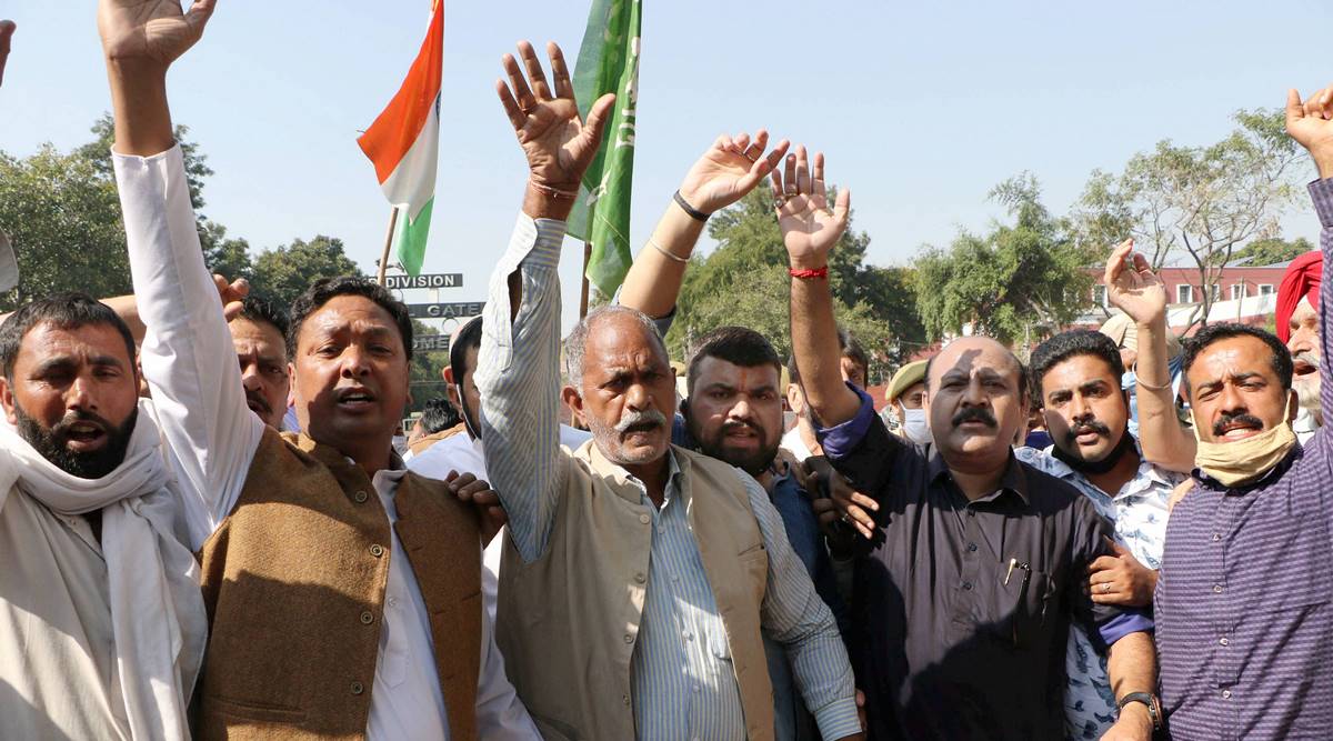 Activists of Peoples Democratic Party (PDP) shout slogans during a protest rally against the central government, in Jammu, Wednesday , Oct. 28, 2020. (PTI Photo)