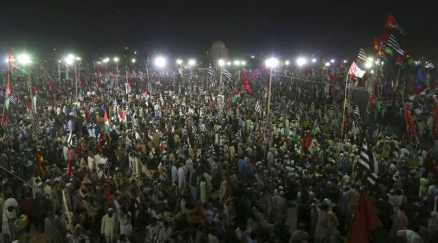 Supporters of the Pakistan Democratic Movement take part in an anti government rally in Karachi, Pakistan, Sunday, Oct. 18, 2020. (AP Photo/Fareed Khan)