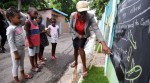 Jamaica, wall backboards, Coronavirus, education, COVID-19 Jamaica updates, Trending news, Indian Express news, lesson on wall painted backboards.
