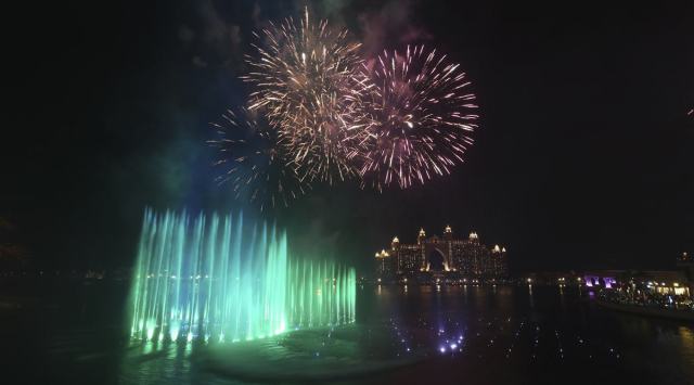 Fireworks explode over The Palm Fountain, world's largest fountain opening ceremony which breaks the Guinness World Record at the Pointe in Dubai, United Arab Emirates, Thursday, Oct. 22, 2020. The Palm Fountain which spreads across 1300 sqm of sea water features over 3,000 LED lights. (AP Photo/Kamran Jebreili)