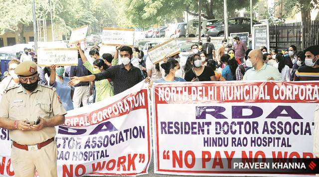 Staff at Hindu Rao Hospital have been protesting over delay in salary by over three months. (Express Photo: Praveen Khanna)