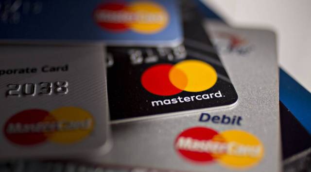 Mastercard Inc. credit and debit cards are arranged for a photograph in Arlington, Virginia, U.S. on Monday, April 29, 2019. Photographer: Andrew Harrer/Bloomberg
