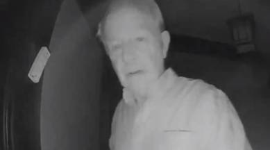 Nobel Prize winner Robert Wilson knocks on neighbour Paul Milgrom's door to inform him that he won; wife sees live on security-camera