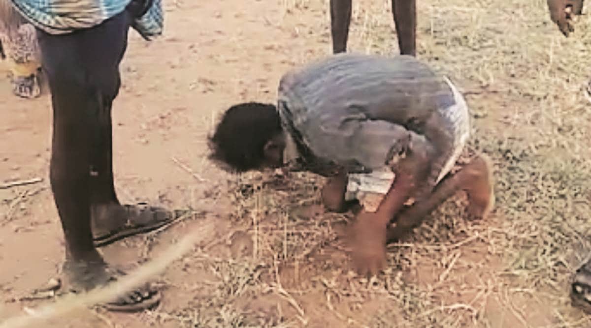 tamil nadu, tamil nadu dalit man assault, dalit man assault video, dalit man frced to touch feet, crime against dalits, Indian express