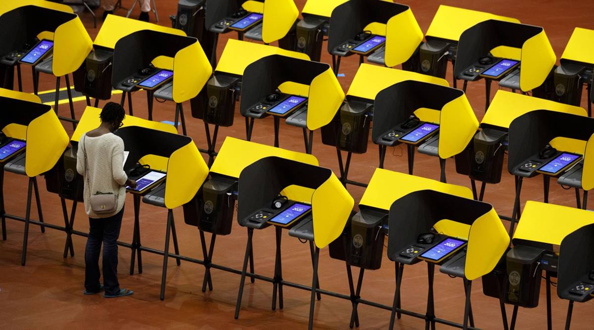Voters cast ballots on electronic Voting Solutions for All People (VSAP) ballot marking machines at an early voting polling location at The Forum arena for the 2020 Presidential election in Inglewood, California, U.S. (Photographer: Patrick T. Fallon/Bloomberg)
