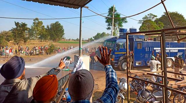 Police use water canon to disperse farmers marching towards New Delhi, near Hisar (AP)