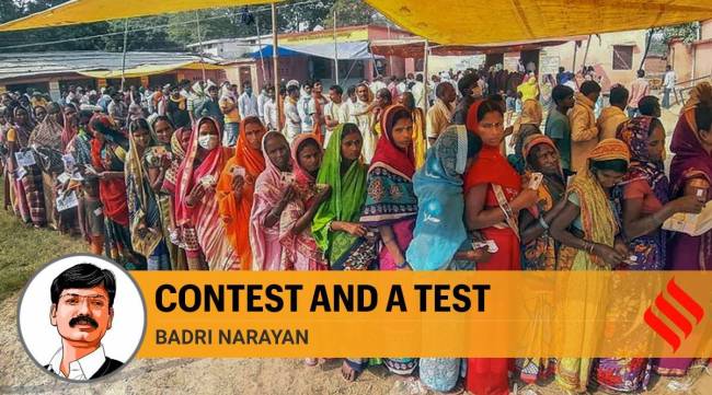 Voters stand in a queue to cast their votes for the second phase of Assembly elections, in Bhagalpur (PTI)