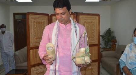 Tripura CM Biplab Deb holds Bamboo candles made by local artisans (Express Photo)