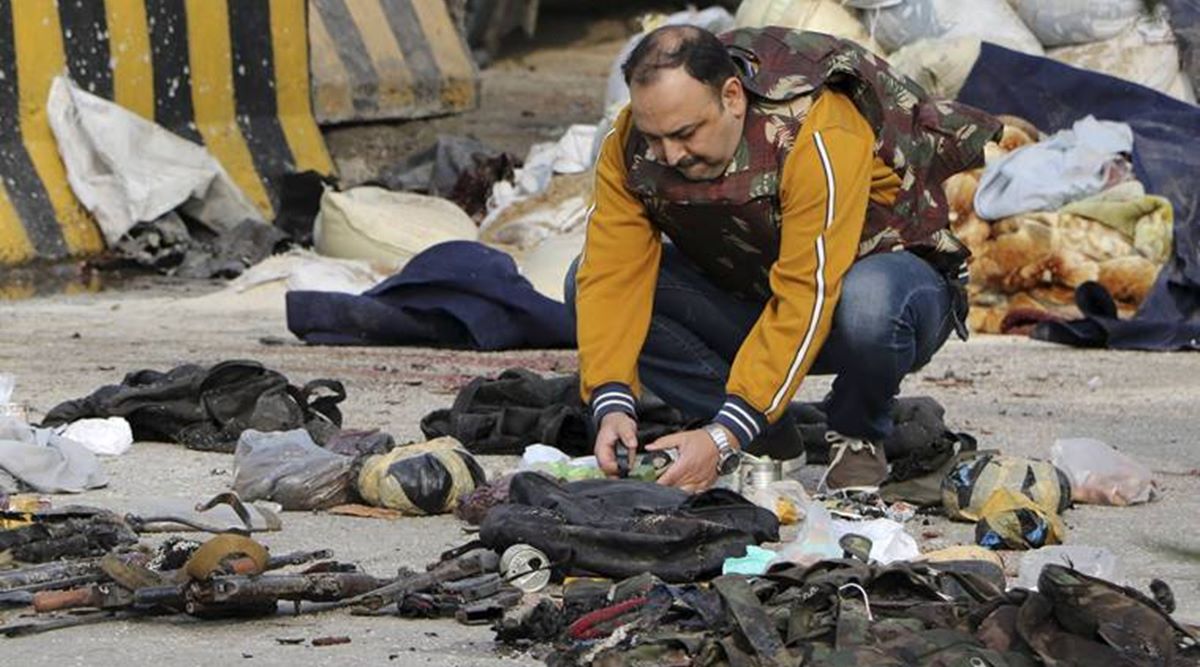 Security personnel inspect the site of encounter at Nagrota Ban toll plaza in Jammu (PTI)