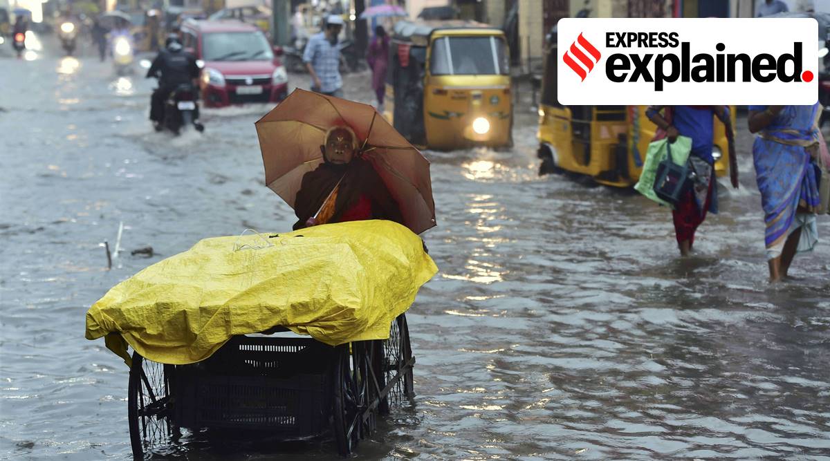 An elderly woman pushes her cart on a waterlogged road during heavy rain triggered by Cyclone Nivar, in Chennai, Tuesday, Nov. 24, 2020. (PTI Photo/R Senthil Kumar)
