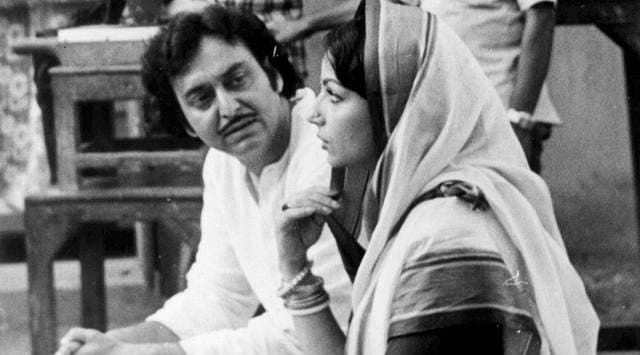 Soumitra Chatterjee with Sharmila Tagore during a shoot. (Express Archive)