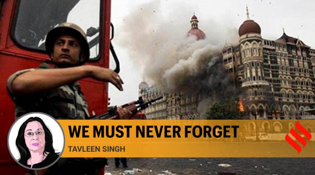 File - Smoke is seen billowing out of the ground and first floor of the Taj Hotel in south Mumbai during security personnel's "Operation Cyclone" following the 26/11 terror attacks in 200. (PTI Photo)