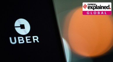 An Uber Technologies Inc. logo sits on a smartphone display. (Bloomberg Photo: Chris J. Ratcliffe)