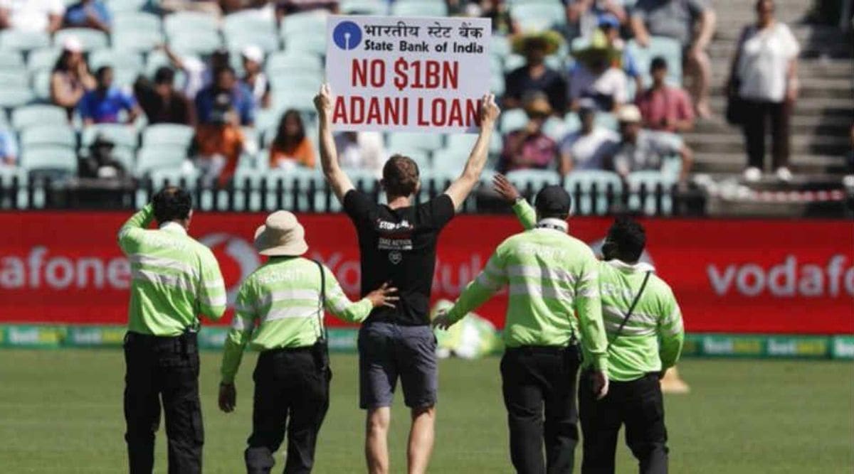 Two protesters enter field with placards during India-Australia ODI