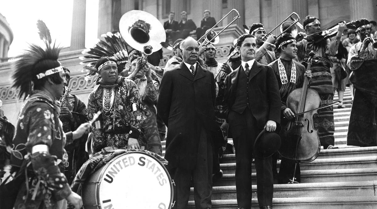 FILE -- Vice President Charles Curtis, center, attends a performance by the United States Indian Band on the steps of the Capitol in Washington on May 11, 1929.  (The New York Times)