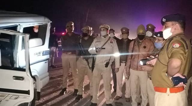 Uttar Pradesh Police officials at the site of the accident. 
