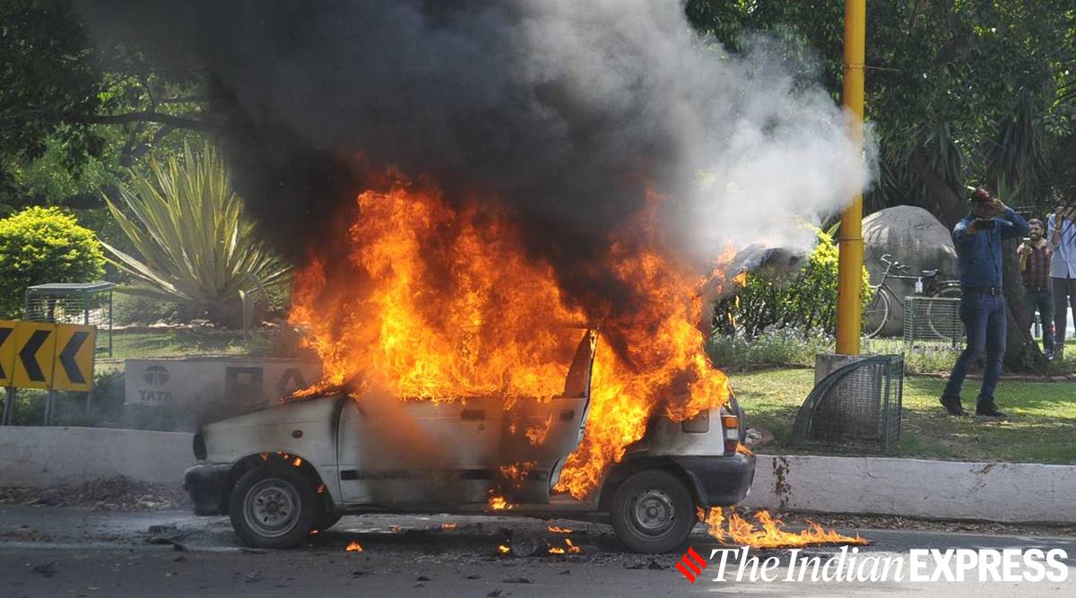 A car catch fire at Sector 7 roundabout in Chandigarh  (Express Photo)