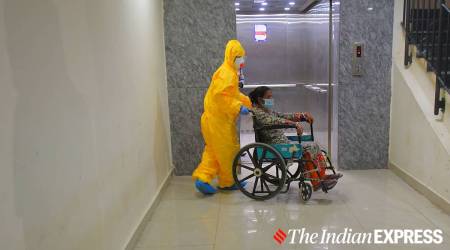 Health workers taking a patient in the isolation room in Tripura's GB hospital (Express photo by Abhisek Saha/File)