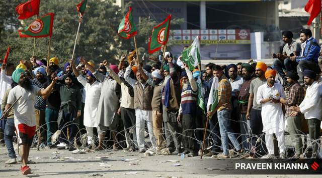 Farmers at the protest site at Burari, in New Delhi on Saturday. (Express photo by Praveen Khanna)