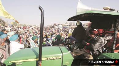 Farmers at the Delhi border, in Singhu, on Saturday. (Express Photo: Praveen Khanna)