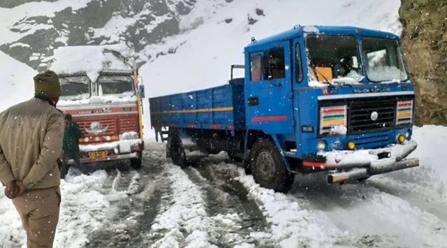 Trucks stranded in a mountainous region of Keylong, following heavy snowfall in Lahaul-Spiti district on Monday. (PTI Photo)