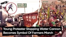 Young Protester Stopping Water Cannon Becomes Symbol Of Farmers March