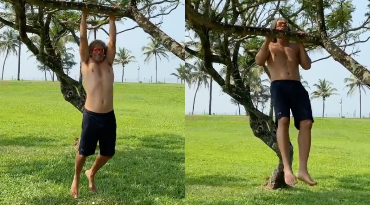 Milind Soman does pull-ups on a tree branch, watch video