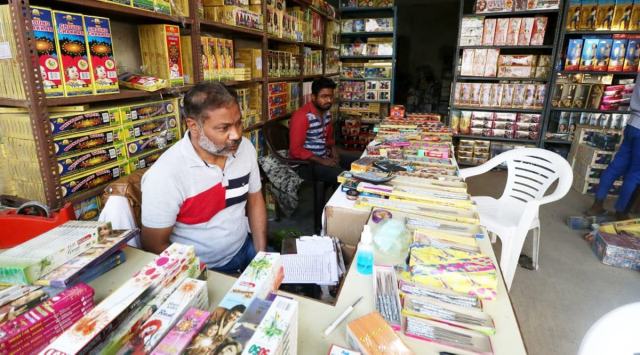 Shop keepers of the cracker wholesale market wating for retail
costumers to sale their products ahead of Deepawali Festival in
Lucknow on Tuesday.