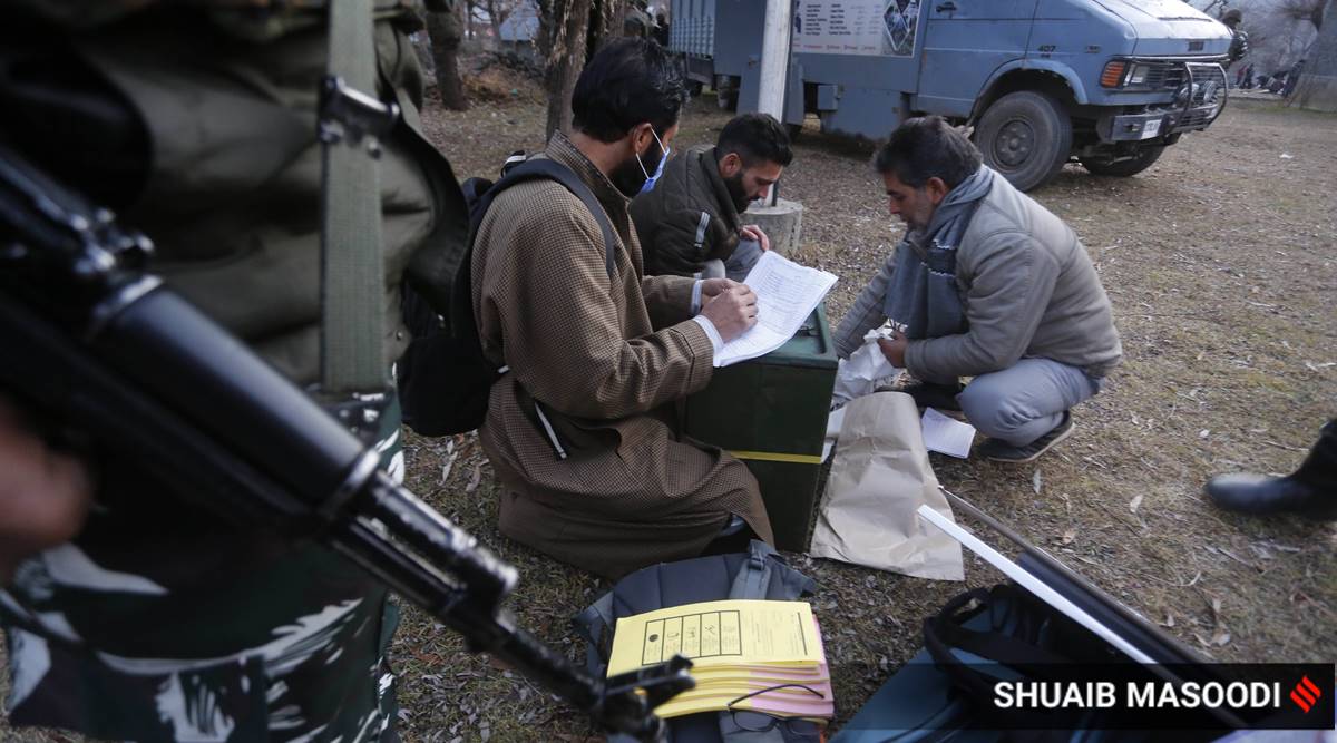Polling staff arrive at a polling booth in Dandaypora Wayal village of Kokernag town in south Kashmir's Anantnag district. (Express photo by Shuaib Masoodi)