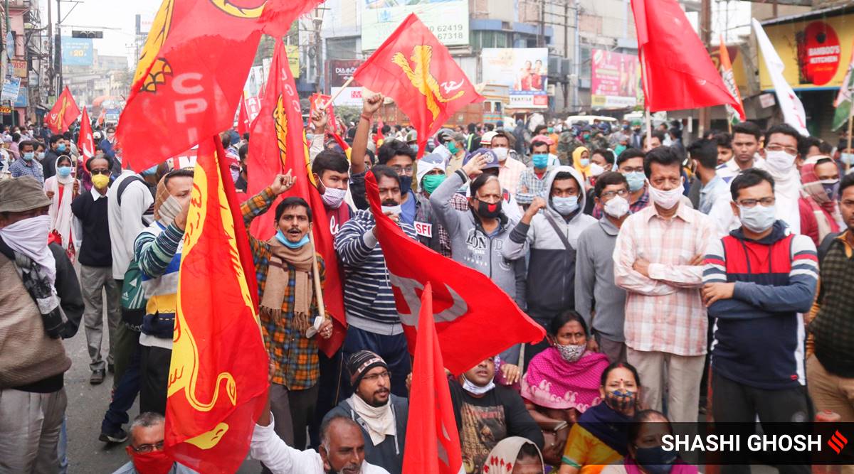 Left and Congress workers block the road at Barasat Champadali intersection in Barasat.
