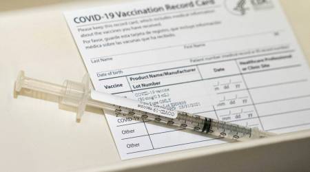 A syringe contains a dose of a Pfizer-BioNtech COVID-19 vaccine sits in a container, Wednesday, Dec. 16, 2020, during a vaccine clinic at Providence Alaska Medical Center in Anchorage, Alaska. The hospital, Alaska's largest, plans to vaccinate 485 people this week. ( (Loren Holmes/Anchorage Daily News via AP, Pool)