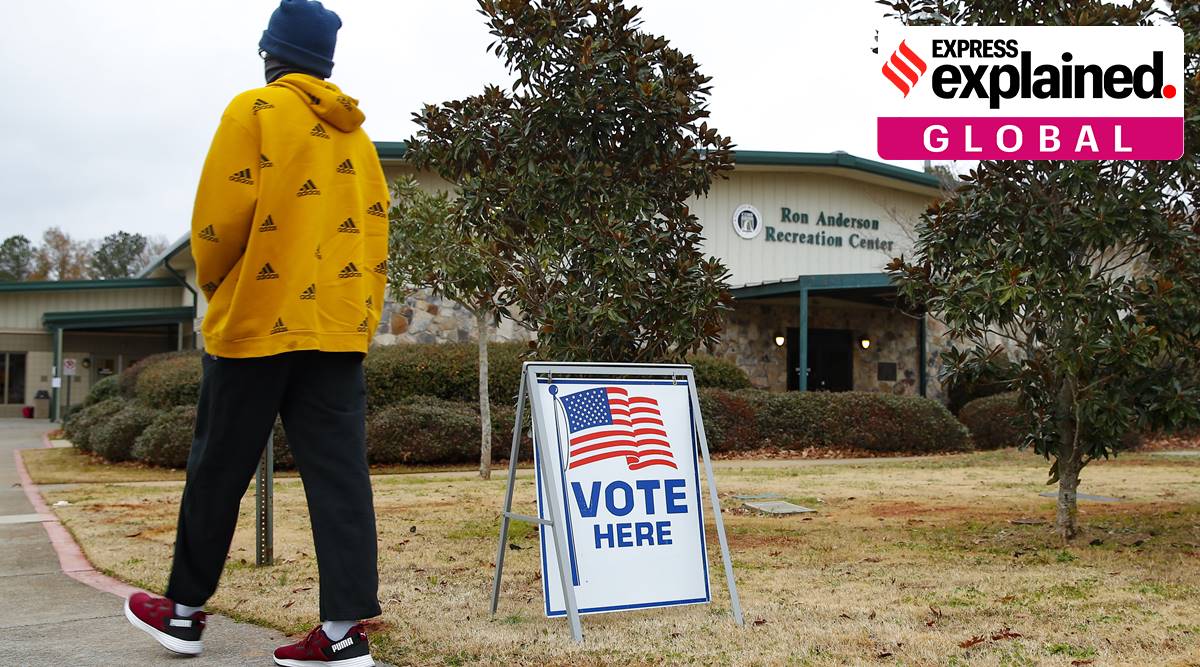 A voter walks to the entrance during early voting for the Senate runoff election, at Ron Anderson Recreation Center, Thursday, Dec. 17, 2020, in Powder Springs, Ga. (AP Photo/Todd Kirkland)