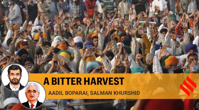 Farmers raise slogans during the ongoing protest against the Center's new farm laws, at Singhu border in New Delhi. (Express Photo: Amit Mehra)