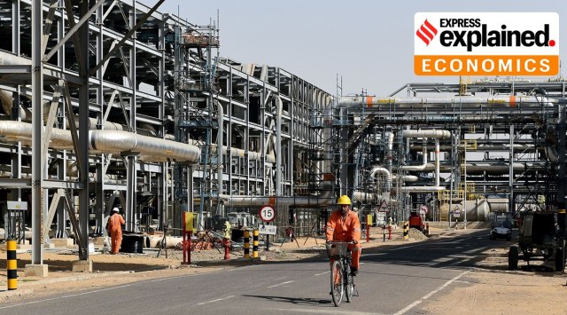 Worker cycles by machinery at Cairn India, Oil and Gas exploration plant at Barmer in Rajasthan. (Photo via Bloomberg)