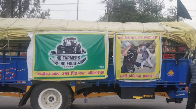 Tractor -trolley from Hoshairpur is on way to Delhi. A stop at Doraha for tea break. (Express photo by Raakhi Jagga)