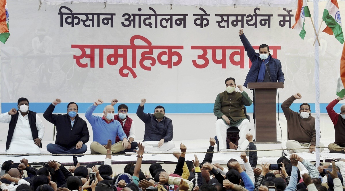 Delhi Chief Minister Arvind Kejriwal addresses during a day-long hunger strike to support farmers, who are protesting against the new farm laws, in New Delhi. Aam Aadmi Party leaders Sanjay Singh, Manish Sisodia, and Satyendra Kumar Jain are also seen. (PTI)